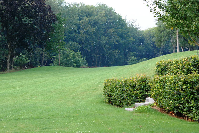 <span>R&eacute;alisations</span><i>→</i>