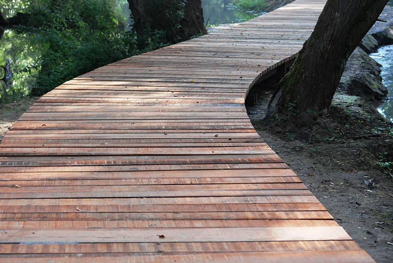 <span>R&eacute;alisations</span><i>→</i>