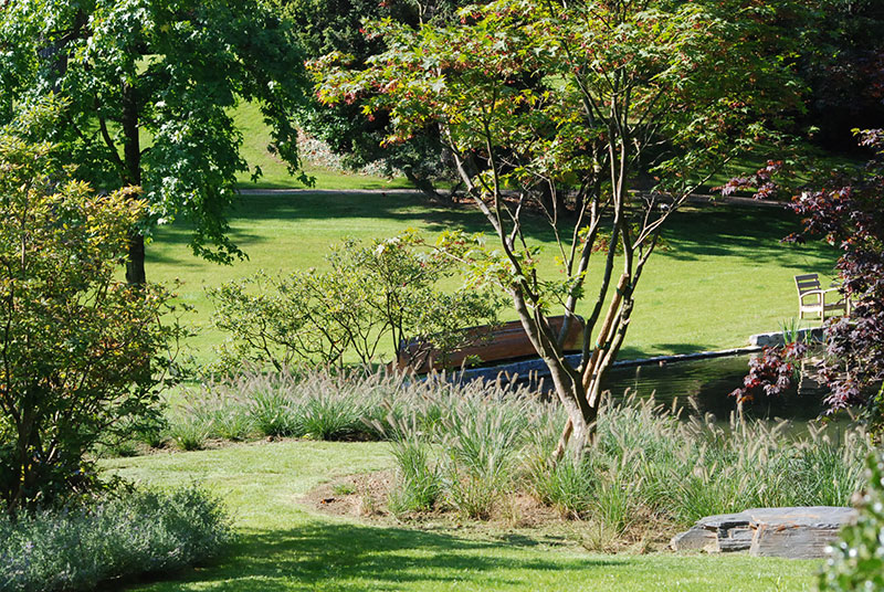 <span>R&eacute;alisations</span><i>→</i>