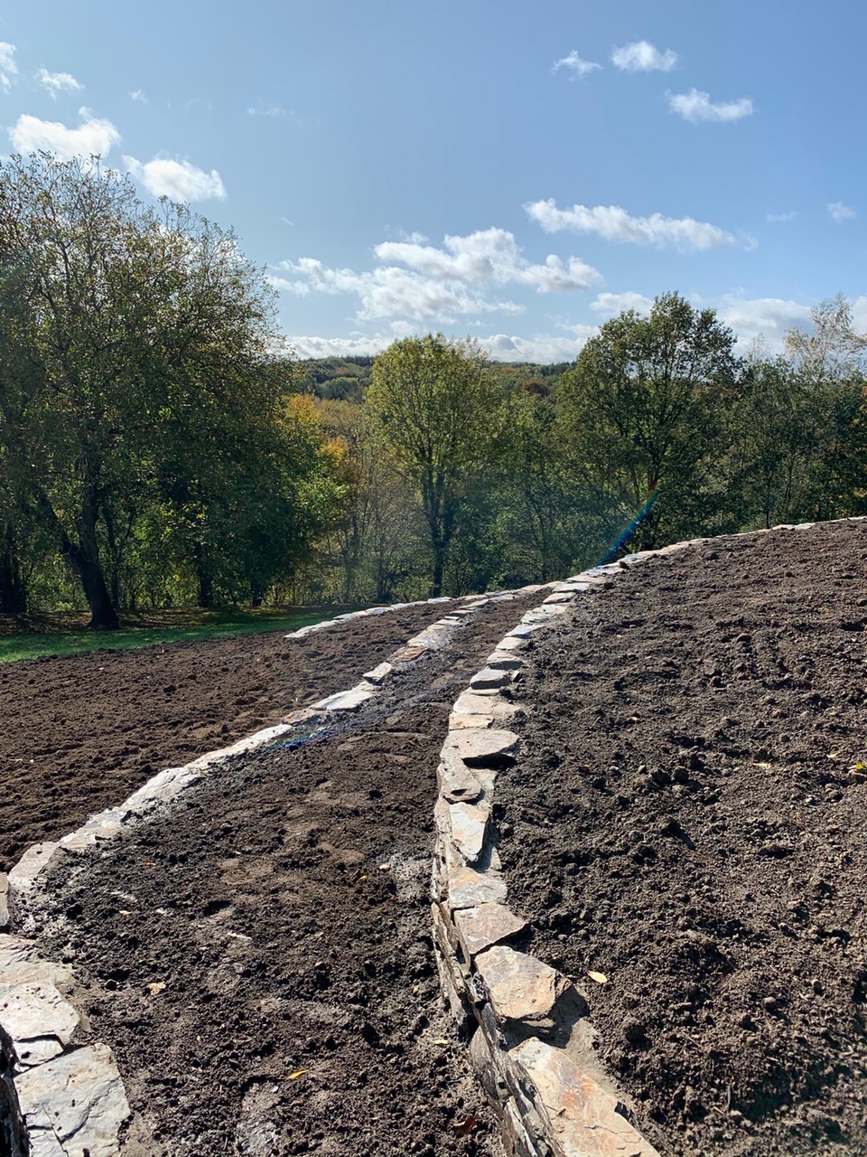 <span>R&eacute;alisations</span><i>→</i>