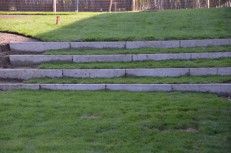 <span>R&eacute;alisations</span><i>→</i>