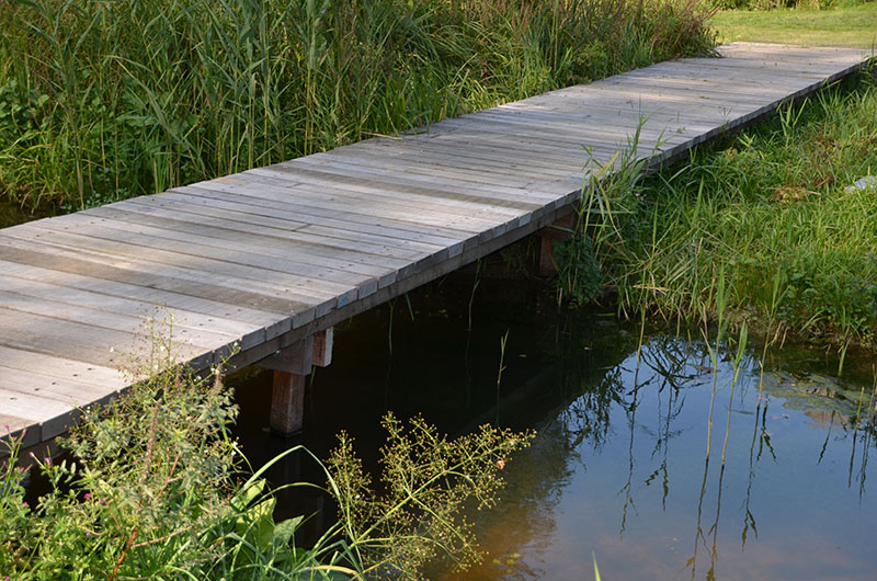 <span>R&eacute;alisations</span><i>→</i>