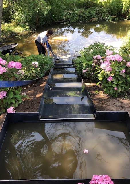 <span>R&eacute;alisations</span><i>→</i>