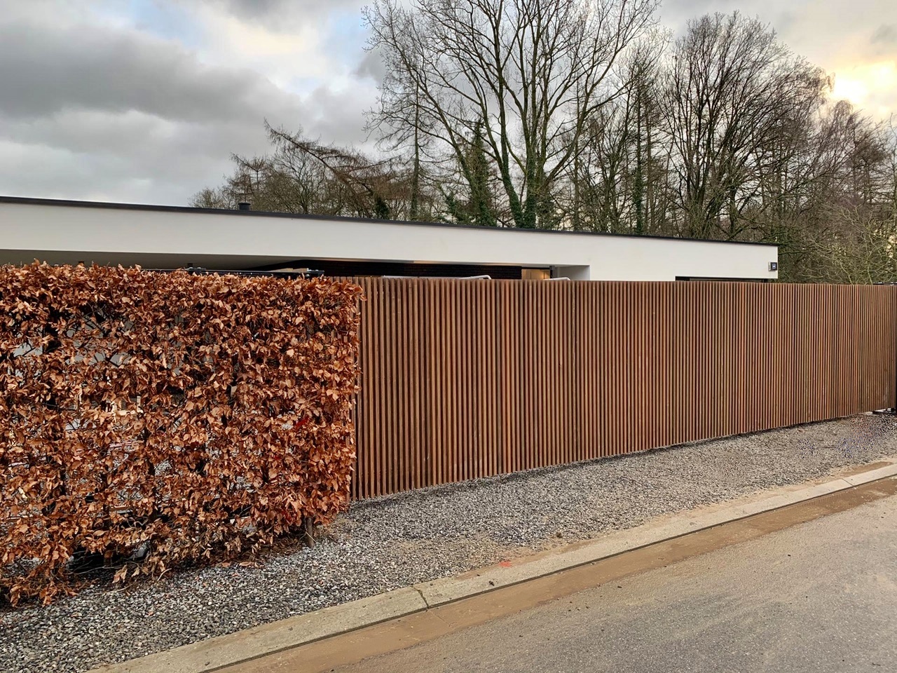 <span>R&eacute;alisations</span><i>→</i>