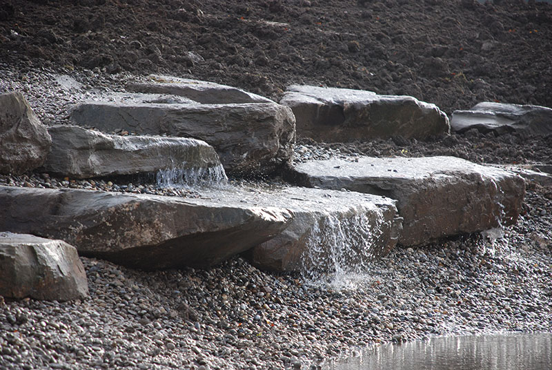 <span>R&eacute;alisations</span><i>→</i>